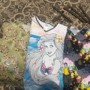 Lot of 3 Disney scrub tops size xs.